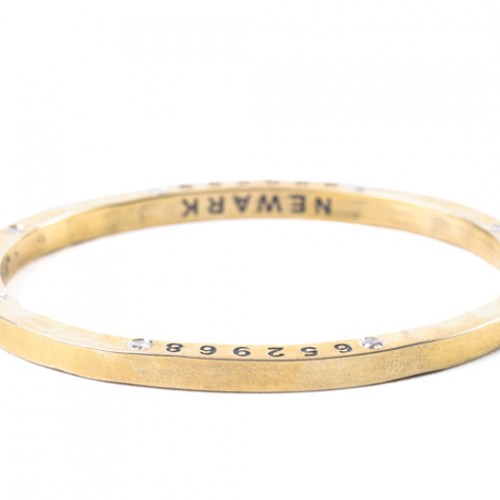 Much prettier than a gun - brass with eight little diamonds (and the number of the Newark gun it came from).