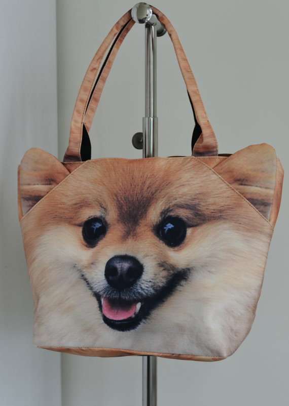 The Pomeranian. Happiest dog-bag in the world. [image from BENWINEWIN]